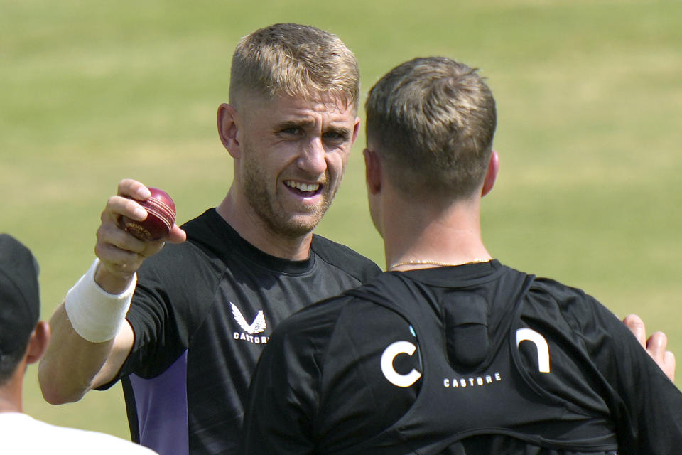 England's Olly Stone, left, briefs a bowling technique to Brydon Carse during a practice session, in Multan, Pakistan, Saturday, Oct. 5, 2024. (AP Photo/Anjum Naveed)