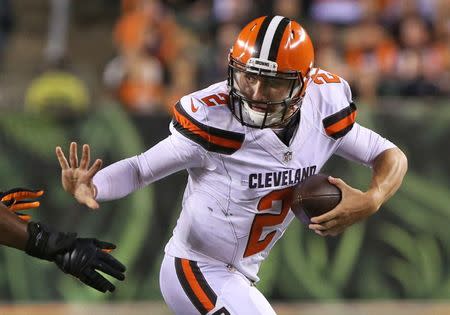 Cleveland Browns quarterback Johnny Manziel (2) scrambles under pressure against the Cincinnati Bengals in Cincinnati November 5, 2015. A Dallas grand jury deciding whether to bring assault charges against Johnny Manziel heard evidence April 21, 2016, after police said the ex-girlfriend of the former Cleveland Browns quarterback told them he beat her, a local district attorney's office said. Mandatory Credit: Aaron Doster-USA TODAY Sports/File Photo Picture Supplied by Action Images