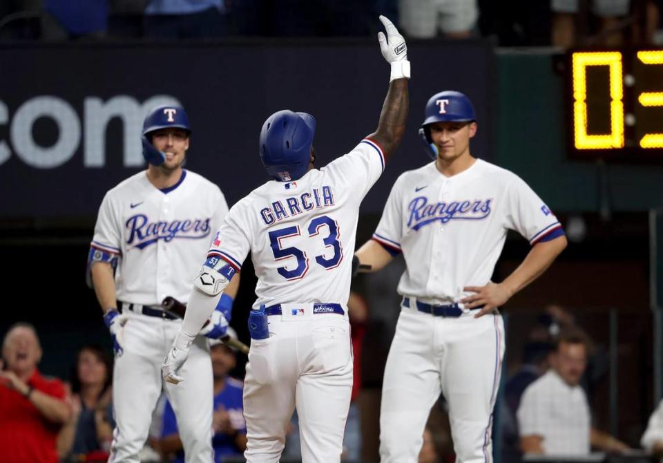 Texas Rangers outfielder Adolis Garcia celebrates with teammates after hitting a home run against the Baltimore Orioles in Game 3 of the ALDS on Tuesday, October 10, 2023, at Globe Life Field in Arlington.