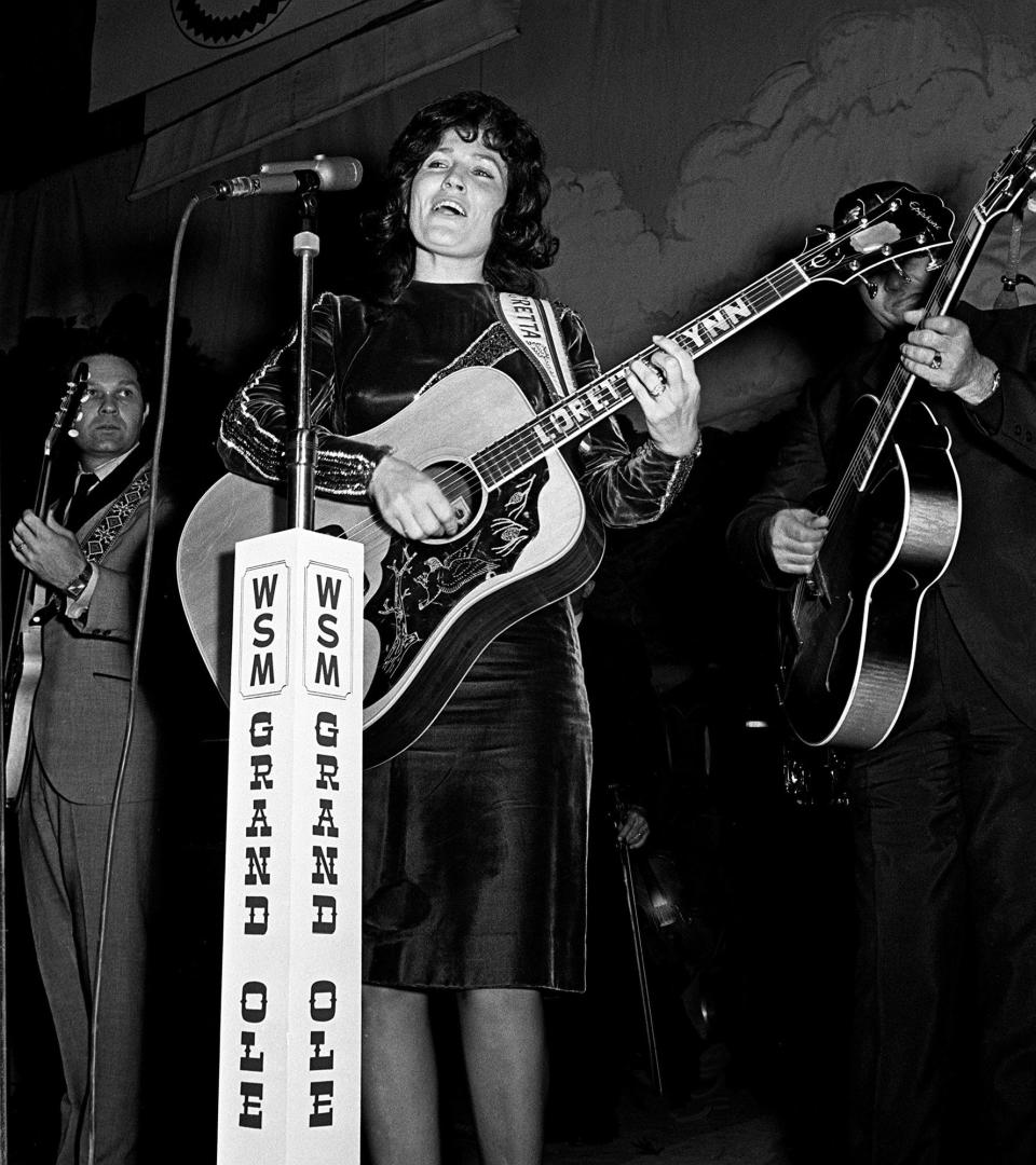 Loretta Lynn performs during a Saturday night Grand Ole Opry show at the Ryman Auditorium on Dec. 10, 1966.