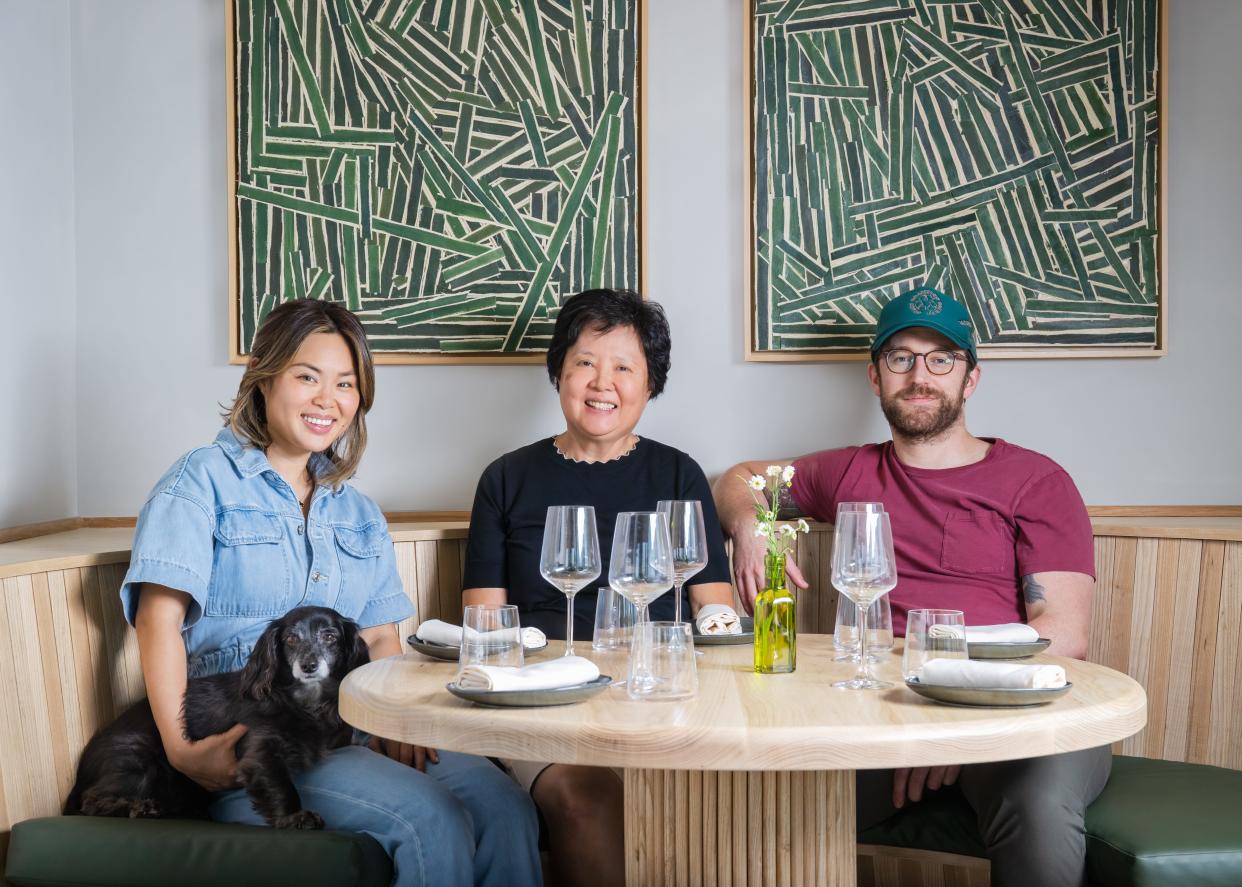 Underdog owners Claudia Lee, left, and fiancée Richard Hargreave, right, turned to Claudia's mother, Christina Lee, for consultation on some of their Korean-inspired dishes.