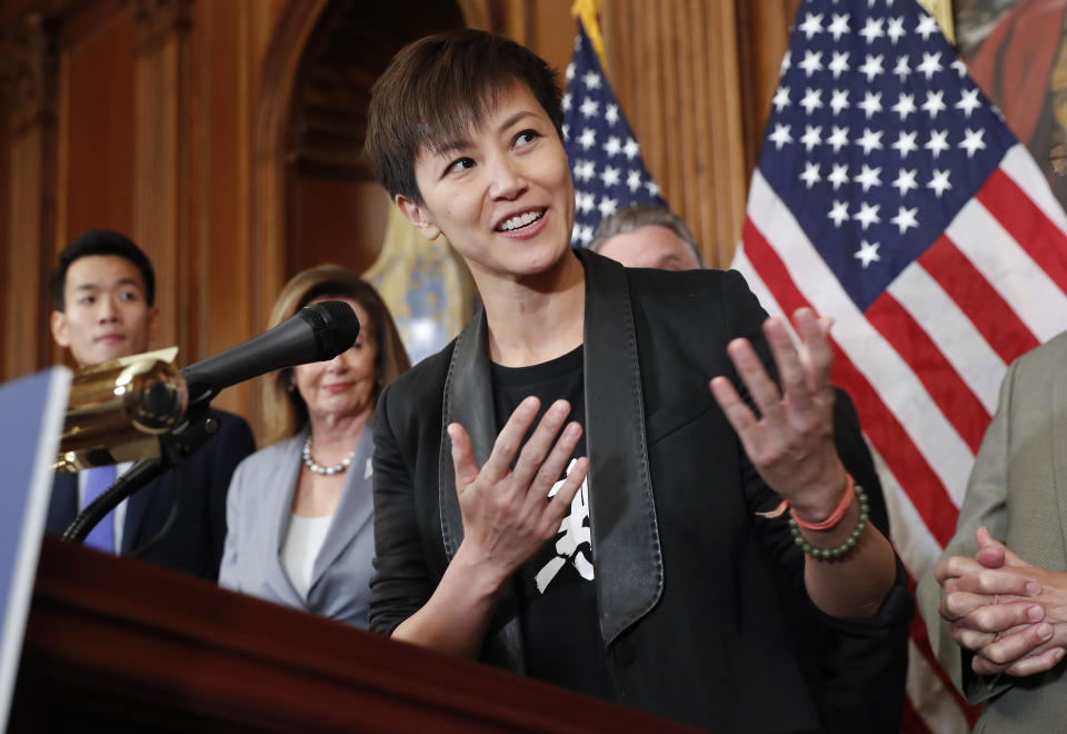 Hong Kong activist Denise Ho, center, speaks as she is joined by members of Congress during a news conference on human rights in Hong Kong on Capitol Hill in Washington, Wednesday, Sept. 18, 2019. (AP Photo/Pablo Martinez Monsivais)