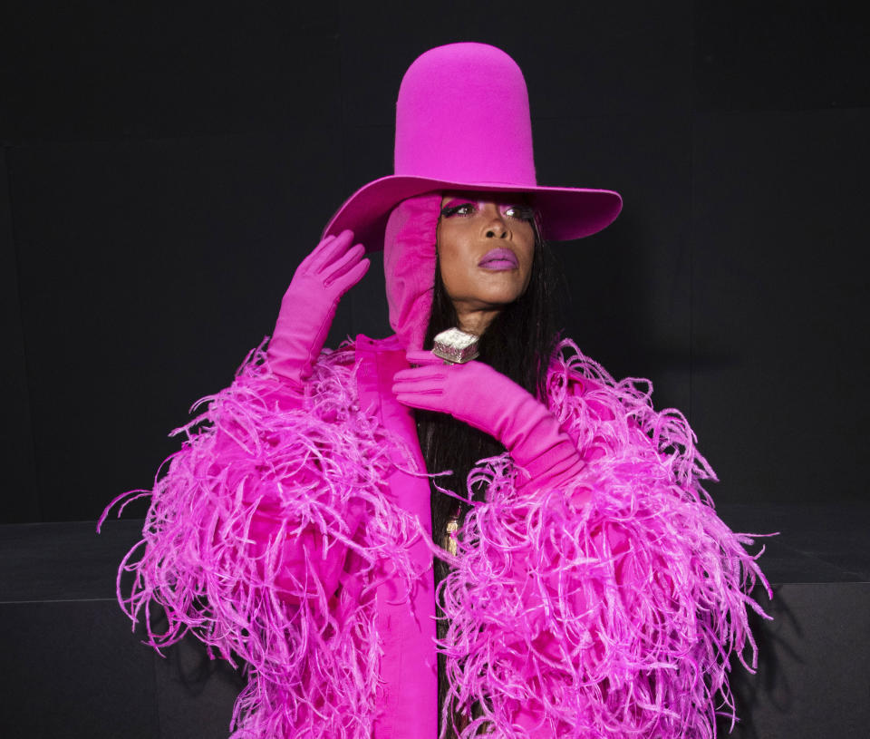 FILE. - Erykah Badu arrives at the Valentino ready-to-wear Spring/Summer 2023 fashion collection presented in Paris on Oct. 2, 2022. The four-time Grammy winner released a 42-piece capsule collection with Italian fashion house Marni last month. (Photo by Vianney Le Caer/Invision/AP, File)