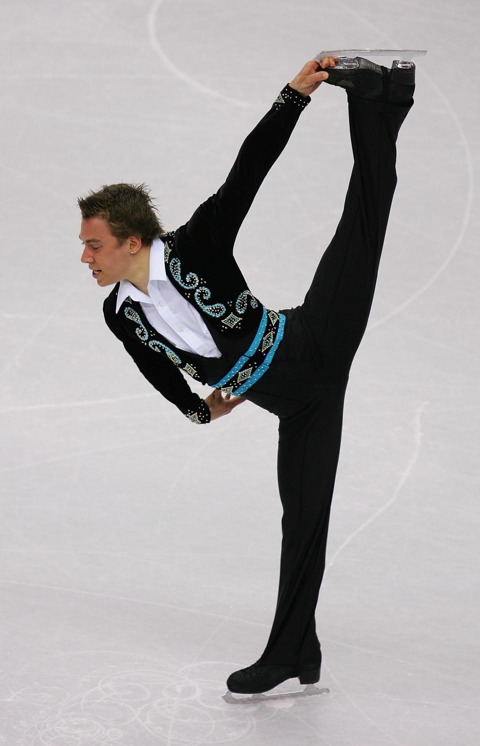 The Canadian competes in the men's short program figure skating at the Turin 2006 Winter Olympic Games.