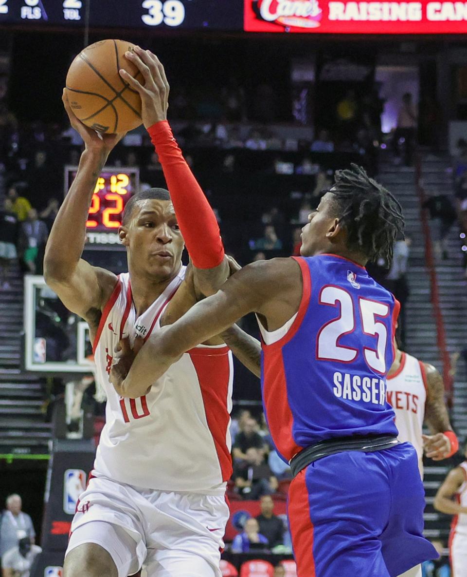 Rockets forward Jabari Smith Jr. is fouled by Pistons guard Marcus Sasser in the first half of the 113-101 loss to the Rockets in the NBA Summer League on Sunday, July 9, 2023, in Las Vegas.