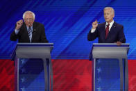 In this Sept. 12, 2019, photo, Sen. Bernie Sanders, I-Vt., left, and former Vice President Joe Biden, right, talk during a Democratic presidential primary debate hosted by ABC at Texas Southern University in Houston. (AP Photo/David J. Phillip)