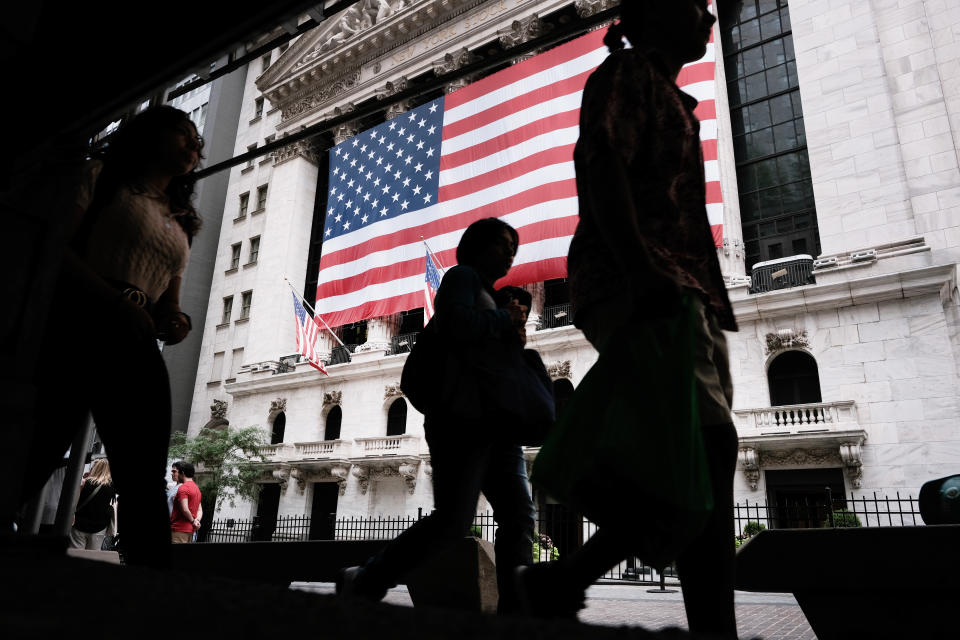 NEW YORK, NEW YORK - AUGUST 10: People walk by the New York Stock Exchange (NYSE) on August 10, 2021 in New York City. Markets were up in morning trading as investors look to a rare bipartisan effort in the Senate to pass a massive infrastructure bill that, if passed, will infuse billions into the American economy. (Photo by Spencer Platt/Getty Images)