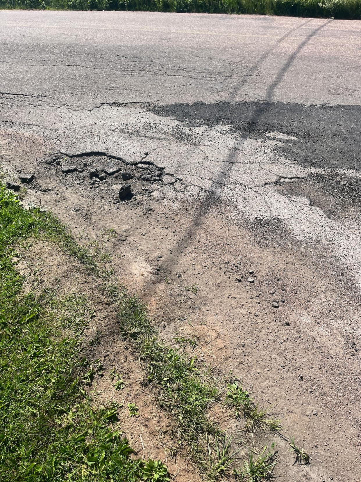 Parts of Route 955 are crumbling and some locals say the government isn't doing enough to fix the road. (Jonna Brewer/CBC NB - image credit)
