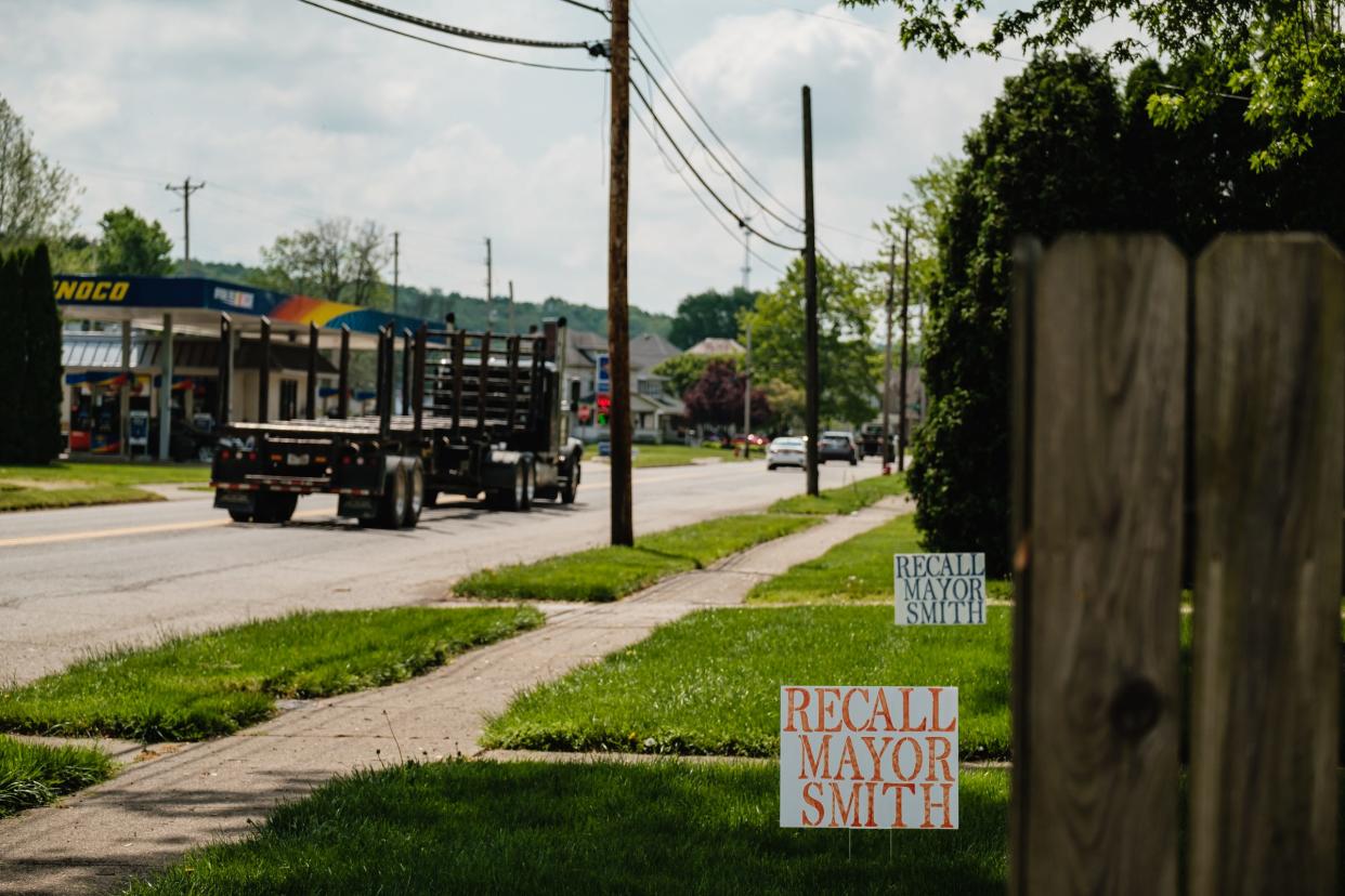 Hand made signs are seen along N. Wooster Ave., Thursday, May 19 in Strasburg.