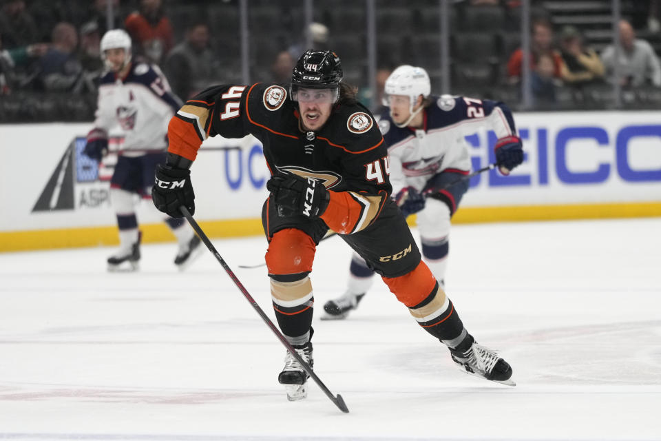 Anaheim Ducks' Max Comtois (44) chases the puck during the first period of an NHL hockey game against the Columbus Blue Jackets Friday, March 17, 2023, in Anaheim, Calif. (AP Photo/Jae C. Hong)