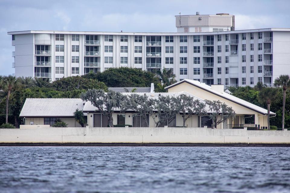 Viewed from the Intracoastal Waterway, a Palm Beach house built in 1981 on Ibis Isle at 2308 Ibis Isle Road W. has sold for a recorded $16.45 million to the neighbors immediately to the east of the property.