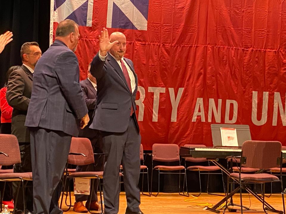 Eighteen-year City Council veteran David Pottier, right, accepts the Council's recommendation to appoint him as Council president for 2024 at the city's inauguration ceremony on Tuesday, Jan. 2, 2024, at the former Coyle & Cassidy high school.