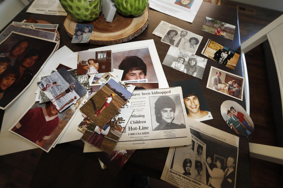 FILE - In this Aug. 12, 2019, file photo, family photographs of Jonelle Matthews, who went missing just before Christmas 1984 and whose remains were found in Greeley, Colo. in 2019, sit on a table in a home in Greeley. The trial for Steve Pankey, a former longshot candidate for Idaho governor who has been indicted in the murder of Jonelle Matthews, is set to begin Wednesday, Oct. 13, 2021. (AP Photo/David Zalubowski, File)