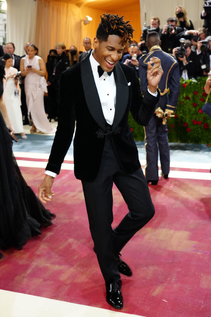 Jon Batiste smiling in a tux