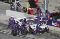 Denny Hamlin makes a pit stop during the NASCAR Cup Series road course auto race at Daytona International Speedway, Sunday, Feb. 21, 2021, in Daytona Beach, Fla. (AP Photo/Terry Renna)