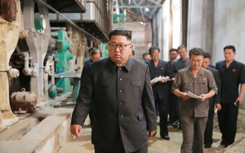 Kim Jong-Un visits the Sinuiju Chemical Fibre Mill - Credit: AFP