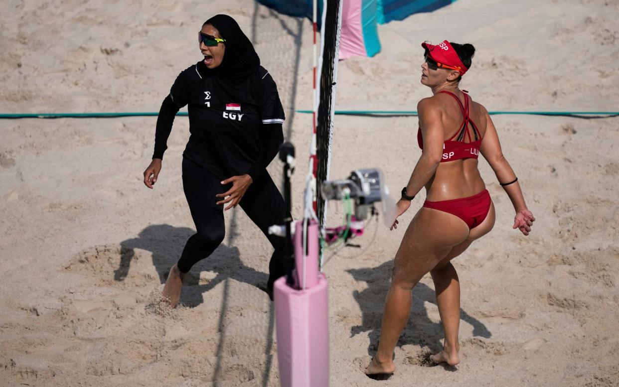 Egypt's Marwa Abdelhady (left) and Liliana Fernández Steiner of Spain during their beach volleyball match at the Paris 2024 Summer Olympics/Egyptian volleyball player hits out at France's hijab ban after facing bikini-clad opposition