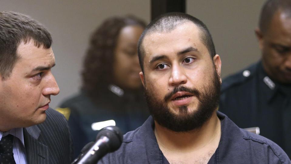 George Zimmerman speaks to defense counsel during a first-appearance hearing in Sanford, Florida