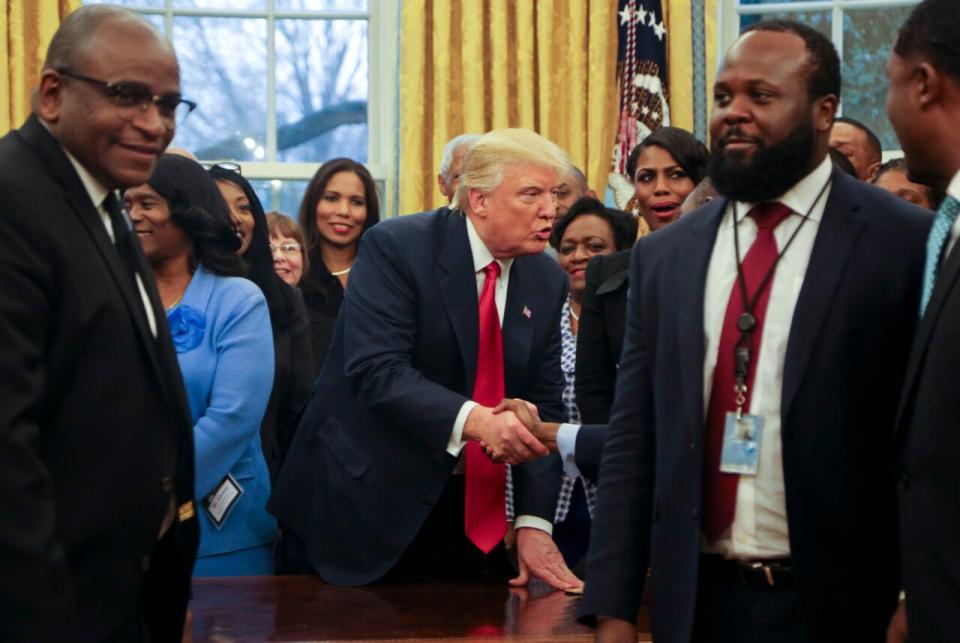 U.S. President Donald Trump shakes hands with members of the Historically Black Colleges and Universities in the Oval Office of the White House, on February 27, 2017 in Washington, DC. (Photo by Aude Guerrucci-Pool/Getty Images)