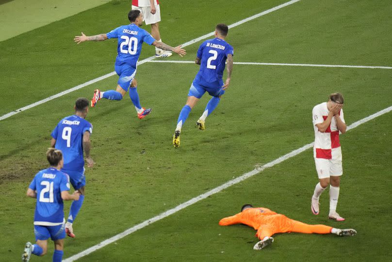 Italian players celebrate the 1-1 equaliser against Croatia