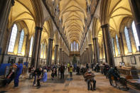 Members of the public receive the Pfizer-BioNTech coronavirus vaccine, at Salisbury Cathedral, in Salisbury, England, Saturday, Jan. 16, 2021. Vaccination centers are being opened in England at some of the country's great cathedrals. Salisbury Cathedral, which also houses a copy of the Magna Carta, opened its great nave to the public. Others will follow as the rollout continues. Organ music played as the jabs were delivered at Salisbury and requests were even taken. (Steve Parsons/PA via AP)