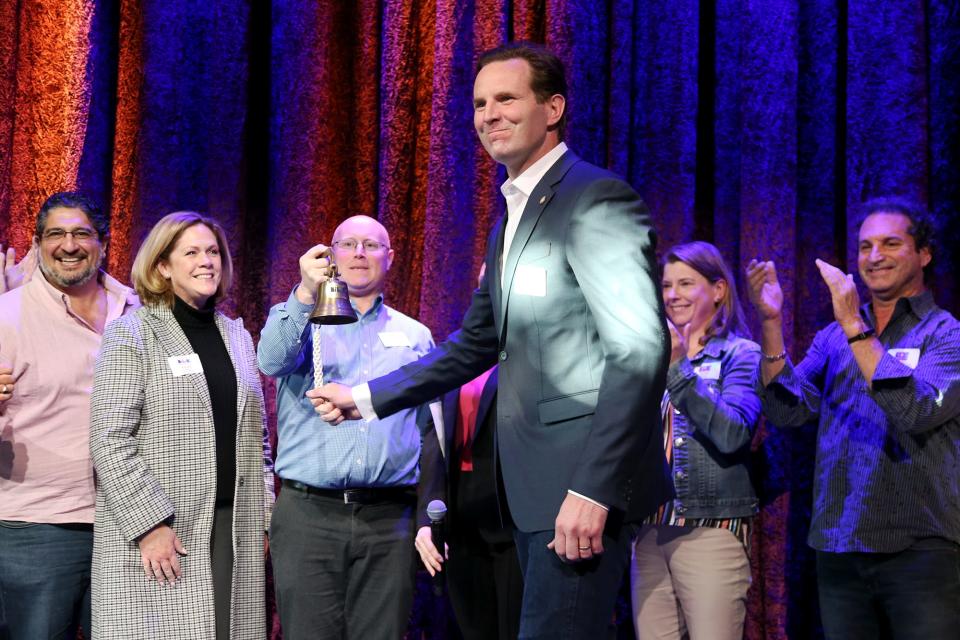 Mayor Deaglan McEachern rings the bell to kick off Spring Restaurant Week in Portsmouth at Jimmy's Jazz and Blues Club on Wednesday, April 20, 2022.