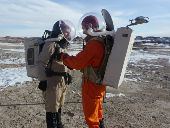 Crew 133 member Matthieu Komorowski (right) assists Joseph Jessup during a "Marswalk" at the Mars Desert Research Station, Jan. 8, 2014.