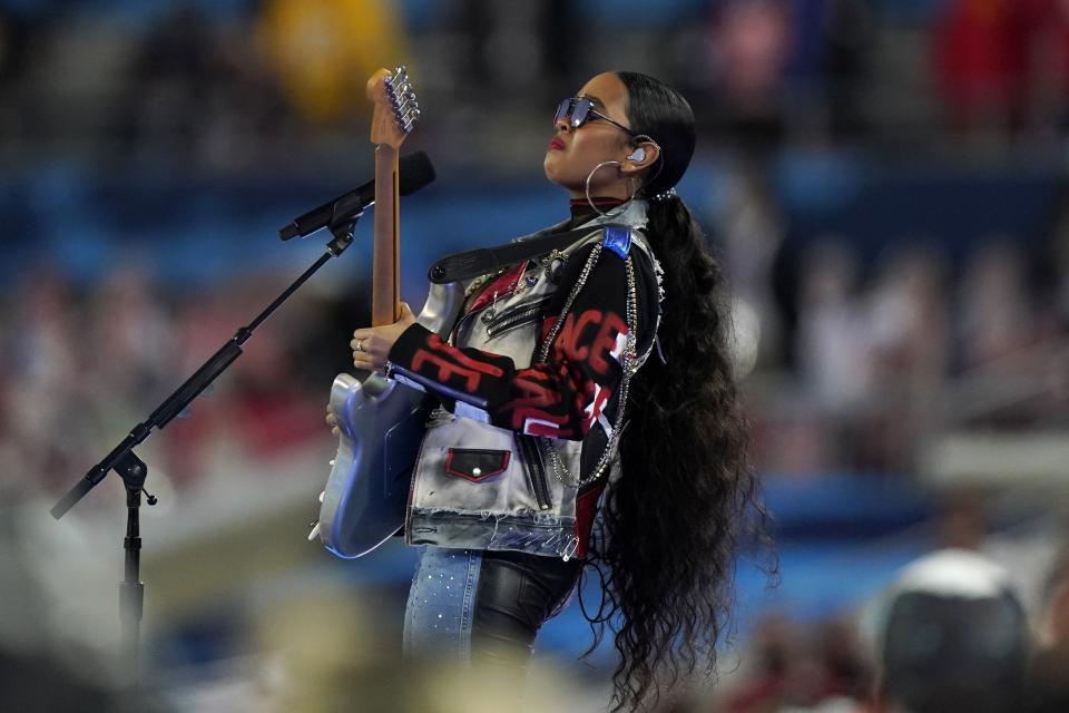 H.E.R. performs "America the Beautiful" before the NFL Super Bowl 55 football game between the Kansas City Chiefs and Tampa Bay Buccaneers, Sunday, Feb. 7, 2021, in Tampa, Fla. (AP Photo/Gregory Bull)