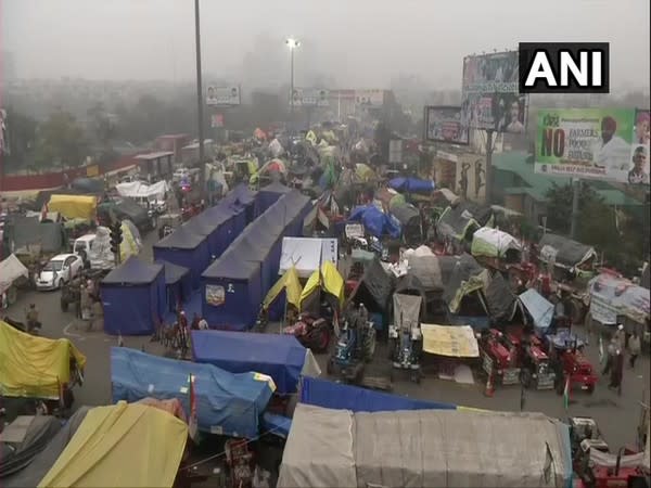 Farmers, with their tractors, continue to gather at Ghazipur border ahead of their proposed tractor rally tomorrow. [Photo/ANI]