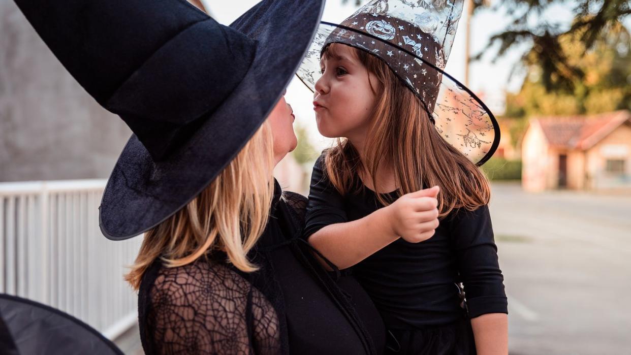 mom and daughter in witch hats