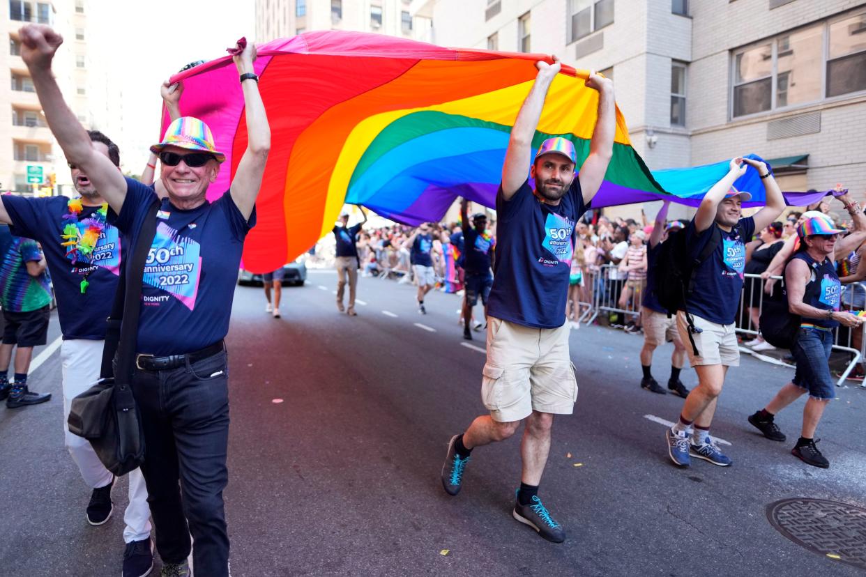 Paradegoers participate in the NYC Pride March on Sunday, June 26, 2022, in New York.