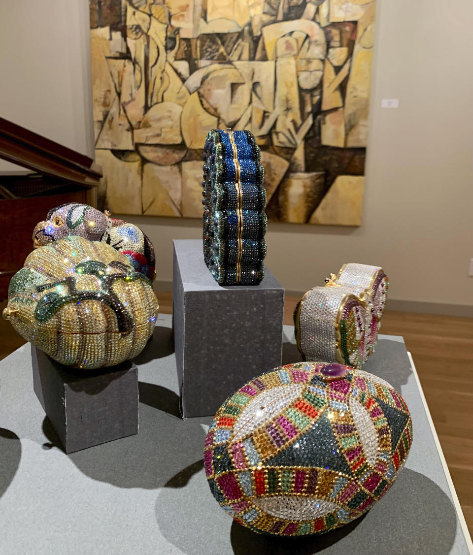 Handbags by Hungarian designer Judith Leiber are displayed at the Leiber Collection in East Hampton, N.Y., on Saturday, Sept. 17, 2022. The couture handbags are made with Swarovski crystals and semi-precious stones, and other accessories. (AP Photo/Pamela Hassell)