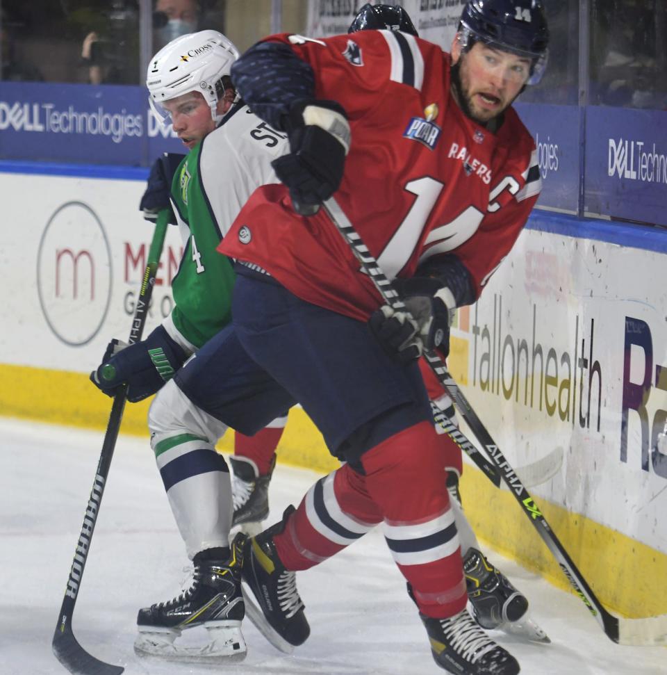 Railers forward Jordan Lavallee-Smotherman, shown tangling with Maine's Brendan St.-Louis during a game last season, will move behind the bench as the new coach/general manager for Worcester.
