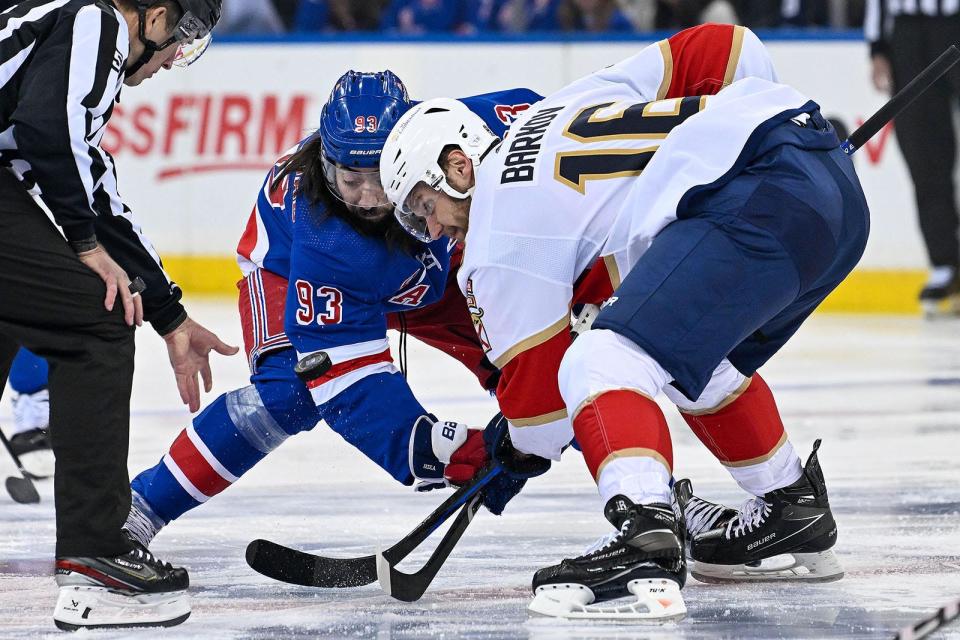 May 30, 2024; New York, New York, USA; New York Rangers center Mika Zibanejad (93) and Florida Panthers center Aleksander Barkov (16) face off during the first period in game five of the Eastern Conference Final of the 2024 Stanley Cup Playoffs at Madison Square Garden.