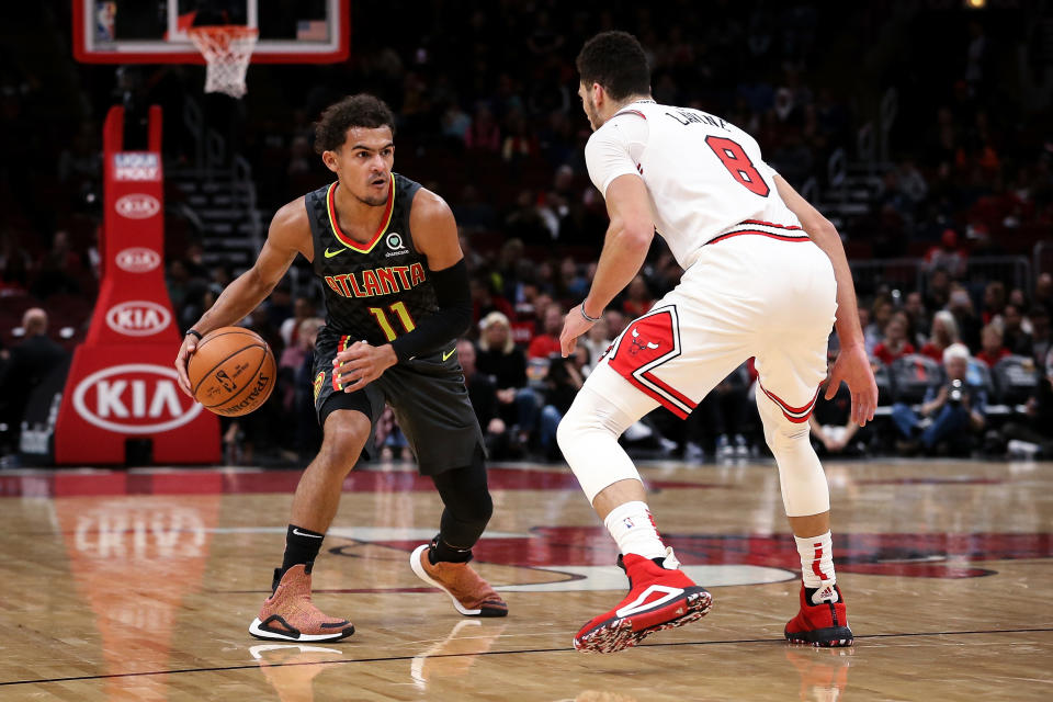 CHICAGO, ILLINOIS - OCTOBER 17:  Trae Young #11 of the Atlanta Hawks dribbles the ball while being guarded by Zach LaVine #8 of the Chicago Bulls in the first quarter during a preseason game at the United Center on October 17, 2019 in Chicago, Illinois. NOTE TO USER: User expressly acknowledges and agrees that, by downloading and/or using this photograph, user is consenting to the terms and conditions of the Getty Images License Agreement. (Photo by Dylan Buell/Getty Images)