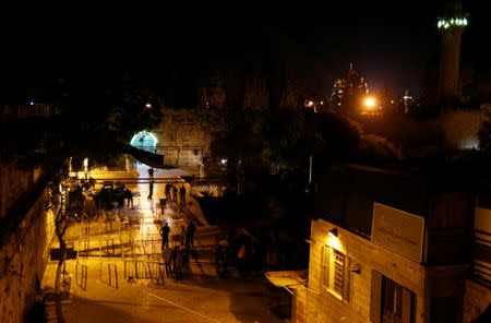 Israeli security forces remove metal detectors which were recently installed at an entrance to the compound known to Muslims as Noble Sanctuary and to Jews as Temple Mount in Jerusalem's Old City July 25, 2017. REUTERS/Ammar Awad