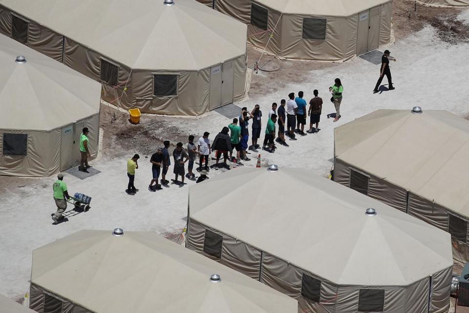 Children and workers are seen at a tent encampment recently built near the Tornillo Port of Entry on June 19, 2018 in Tornillo, Texas. The Trump administration is using the Tornillo tent facility to house immigrant children separated from their parents (Getty Images)