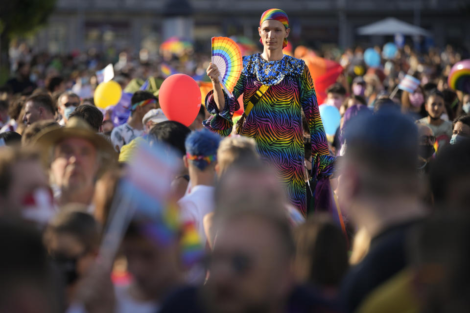 A person wears rainbow colors during the Bucharest Pride 2021 in Bucharest, Romania, Saturday, Aug. 14, 2021. The 20th anniversary of the abolishment of Article 200, which authorized prison sentences of up to five years for same-sex relations, was one cause for celebration during the gay pride parade and festival held in Romania's capital this month. People danced, waved rainbow flags and watched performances at Bucharest Pride 2021, an event that would have been unimaginable a generation earlier. (AP Photo/Vadim Ghirda)