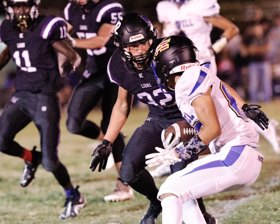 Redding Christian's Noah Gulstrom (32) looks to tackle a Maxwell player in their game Friday, Sept. 23, 2022, in Palo Cedro.