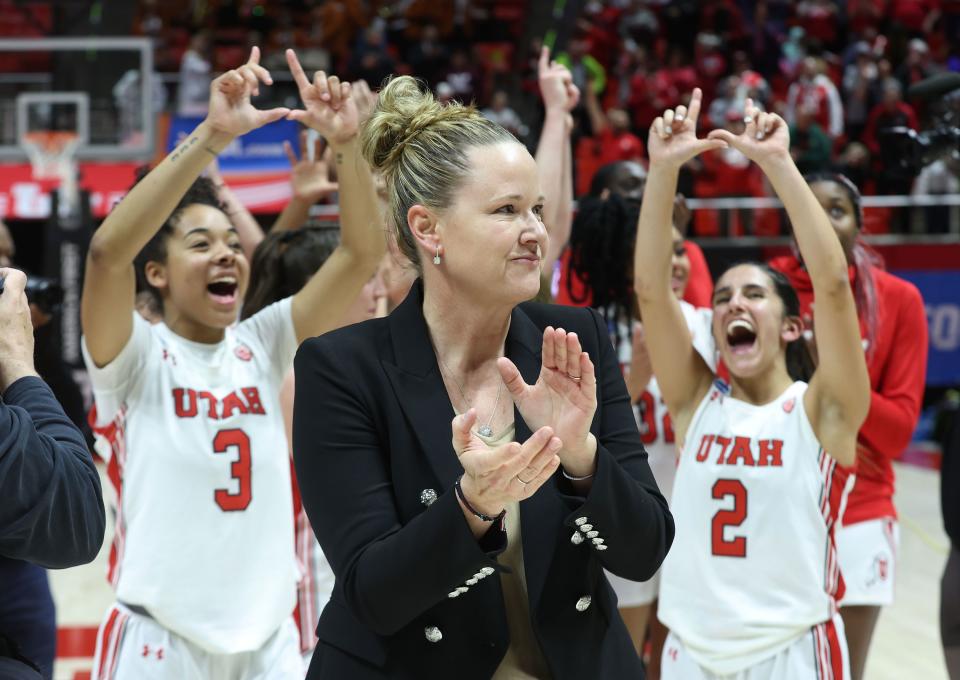 Utah Utes head coach Lynne Roberts and the Utes celebrate the win over the Princeton Tigers.