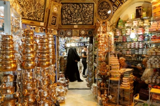 Iranian women shop at Tehran's ancient Grand Bazaar on July 28, 2018