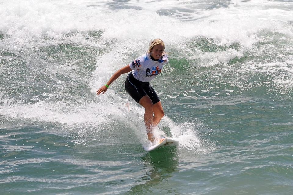 Bethany Hamilton competes in the 2010 US Open of Surfing at the Huntington Beach pier.