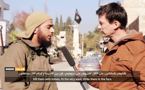 Salim Benghalem being interview by John Cantlie, a British journalist captured by Isil, on one of its propaganda channels - Credit: Hayat Media