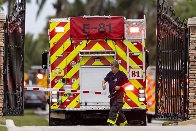 <p>Matias J. Ocner/Miami Herald via AP</p> Emergency crews respond to Tyreek Hill's home on Wednesday