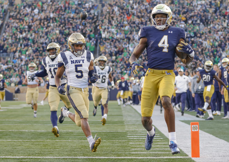 SOUTH BEND, IN - NOVEMBER 06: Kevin Austin Jr. #4 of the Notre Dame Fighting Irish scores during the game against the Navy Midshipmen at Notre Dame Stadium on November 6, 2021 in South Bend, Indiana. (Photo by Michael Hickey/Getty Images)