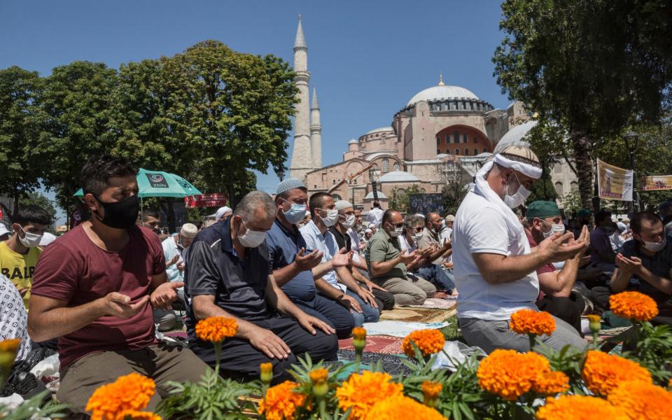 Worshippers gather outside the Hagia Sophia mosque in Istanbul, which on Friday held its first service as a mosque since 1935 - Sam Tarling for The Telegraph 