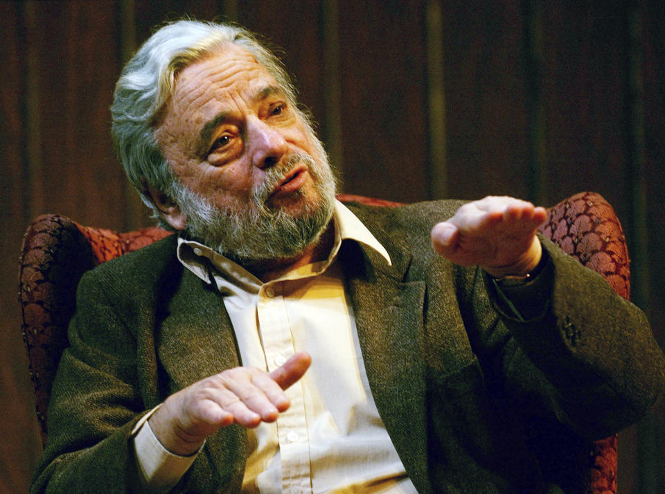 FILE - Composer and lyricist Stephen Sondheim gestures during a gathering at Tufts University in Medford, Mass., on April 12, 2004. Sondheim, the songwriter who reshaped the American musical theater in the second half of the 20th century, has died at age 91. Sondheim's death was announced by his Texas-based attorney, Rick Pappas, who told The New York Times the composer died Friday, Nov. 26, 2021, at his home in Roxbury, Conn. (AP Photo/Charles Krupa, File)