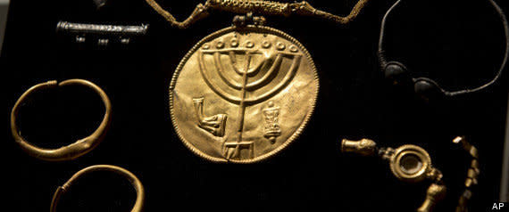 An Israeli archaeologist says she has uncovered a rare trove of ancient coins and medallions near Jerusalem's Temple Mount.  Eilat Mazar of Jerusalem's Hebrew University says among the finds are jewelry and a gold medallion with the Jewish menorah symbol etched into it. Other findings include items with additional Jewish symbols such as a ram's horn and a Torah scroll.  <a href="http://www.huffingtonpost.com/2013/09/09/temple-mount-ancient-treasure_n_3893761.html" target="_blank">Read more</a>