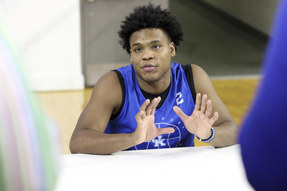 Kentucky's Sahvir Wheeler answers a question during the school's NCAA college basketball media day in Lexington, Ky., Wednesday, Oct. 20, 2021. (AP Photo/James Crisp)