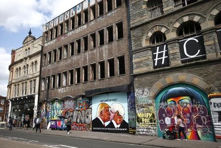 A mural of Donald Trump embracing Boris Johnson is seen on a building in Bristol, Britain May 24, 2016. REUTERS/Peter Nicholls